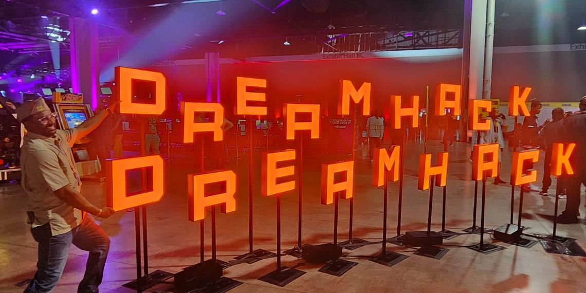 State Jr Vice Commander Sherrod Conyers stands in front of the DreamHack Atlanta 2025 sign.